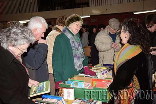 Pat Looby selling books at Fethard Historical Society stall to Agnes Evans.