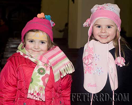 Photographed at the Annual Carol Service at Holy Trinity Church are L to R: Emma Hayes and Abbie Tillyer