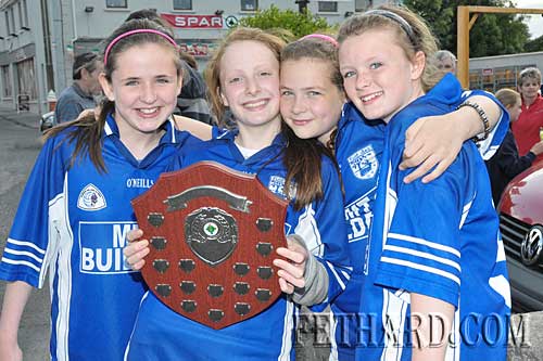 Four proud Fethard girls celebrate with county trophy. L to R: Laura Ryan, Annie Prout, Jessie McCarthy and Katie Butler.