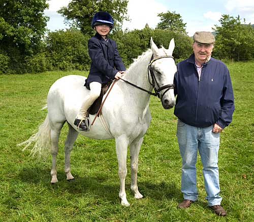 Megan Coen on Topper with her grandfather Pat Carroll at Killusty Show 2009