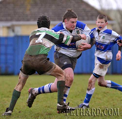 Sam Manton in defence breaking away with the ball in their under-16 rugby match against Clonmel played in Fethard last weekend