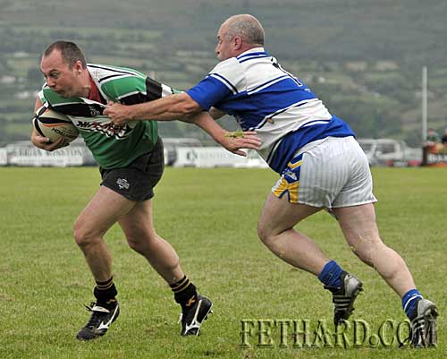 Playing his first game of rugby, Tom Anglim gets to grips with the game to stem another Clonmel attack