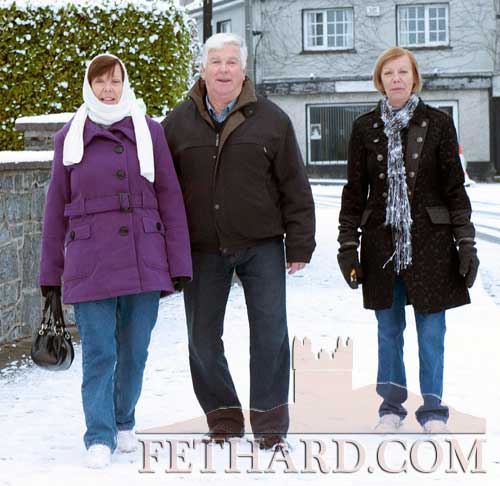Jim Allen photographed with his sisters Catherine (left) and Celia well wrapped up for the weather in Fethard last Sunday.