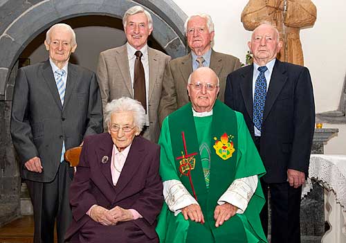 Fr. Joe Walsh and his family photographed at this Golden Jubilee in the Augustinian Abbey Back L to R: Brothers Michael, Christy, John and Jimmy Walsh. Front L to R: Peg O'Dea (sister) and Fr. Joe Walsh OSA.