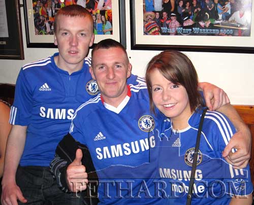 Chelsea supporters celebrating in Fethard last weekend after their team took one step closer to winning the title. L to R: Adam Lyons, Ronan Allen and Amy Lyons.