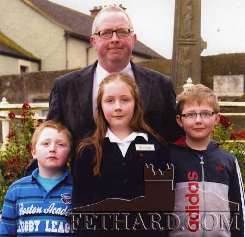 Paul Duggan, Killusty, photographed with his children Jacques, Phoebe and Andy on the occasion of Phoebe' Confirmation in Holy Trinity Parish Church, Fethard. 