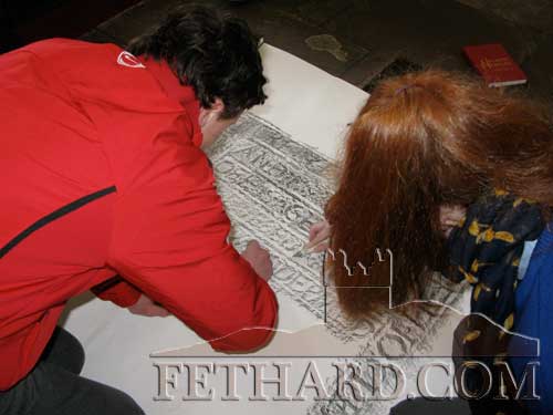 Students taking rubbings from the graveslabs in Holy Trinity Church of Ireland, Fethard.