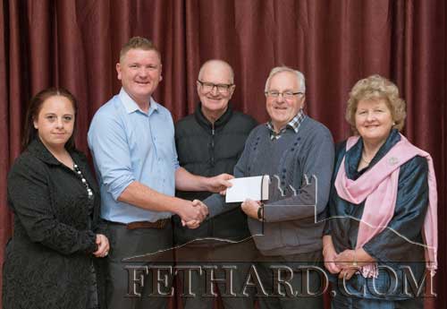 Paddy Ryan, originally from St. Patrick's Place, Fethard, presenting a cheque to the Fethard Critical Illness Fund on hehalf of his late partner Gemma Slattery. Photographed at the presentation L to R: Gina Slattery, Paddy Ryan, Dinny Burke, Walty Moloney and Nellie Ryan.