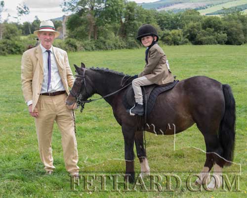 Frank Quirke with his son Joe riding 'Melody' at the Killusty Show