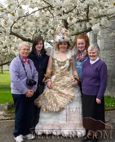 Students, Orla Walsh, Katie White (‘Arctic Queen’) and Louise Fitzgerald, photographed under the Apple Blossom tree with Sr. Betty and Sr. Maureen in the convent grounds. 