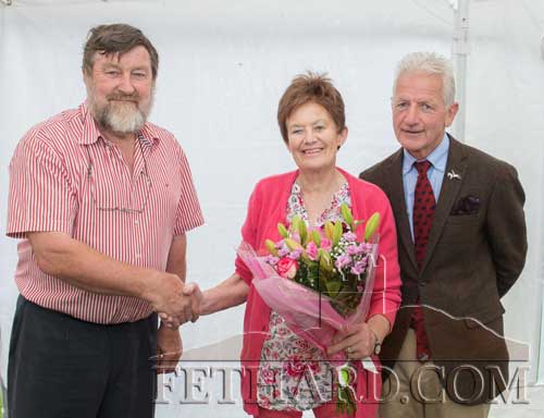 Noel Byrne (chairman) making a presentation to Di Stokes marking her dedicated service to Killusty Pony Show over 40 years. Also included is committee member Pat Culligan (right).