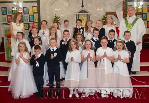 Boys and girls who received their First Holy Communion at Holy Trinity Parish Church. Included also is Canon Tom Breen P.P. and teacher Lisa Kearney.
