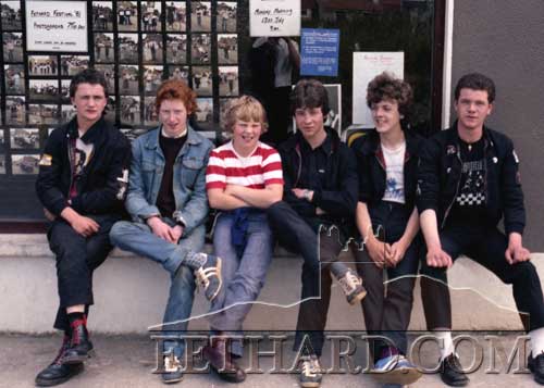 Sitting ouside a display of Fethard Festival Parade Photos in Kenny's shop window, July 1981, are L to R: Cyril Keane, Nigel O'Donnell, James Connolly, Paul Trehy, Pat O'Meara and Eddie Trehy.