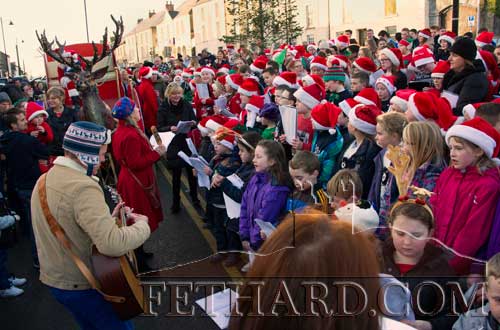 Santa Claus’s visit to Fethard on December 11 was a huge hit to local boys and girls who came along with their families to greet his colourful arrival by sleigh. First to meet Santa were the pupils attending Holy Trinity National School and Community Playgroup who thronged the school playground and cheered his entry at 2pm. School principal Ms Tríona Morrisson, presented a cheque of €400 on behalf of the pupils, for Santa to deliver to Temple Street Hospital in Dublin. 