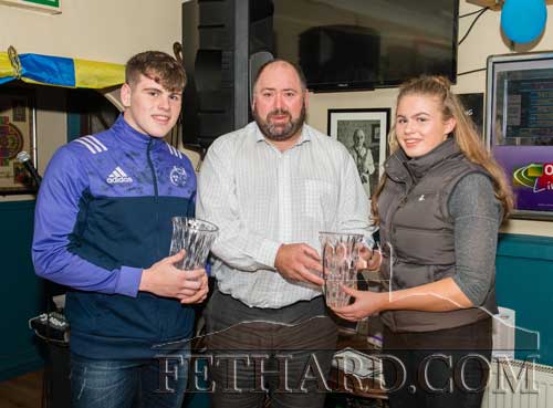 Liam Downey (centre), representing this month’s sponsor, J.C. Kenny Wine Distributors, Galway, presenting the September Sports Achievement Awards to Ross McCormack and Dorothy Wall, both represented Munster at U18 Rugby.