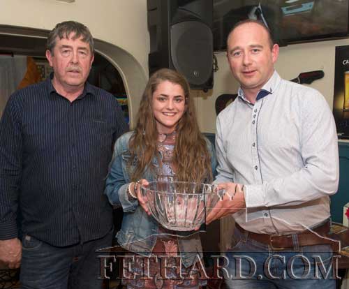 Abaigeal Maher (centre) receiving the Butler’s Bar Fethard Sports Achievement Award for May from this month's sponsor, Des O'Meara (right), Sports Injury Clinic, Tullamaine. Also included is Philip Butler, proprietor of Butlers Sports Bar, Fethard, whose premises promote the annual and monthly achievement awards.