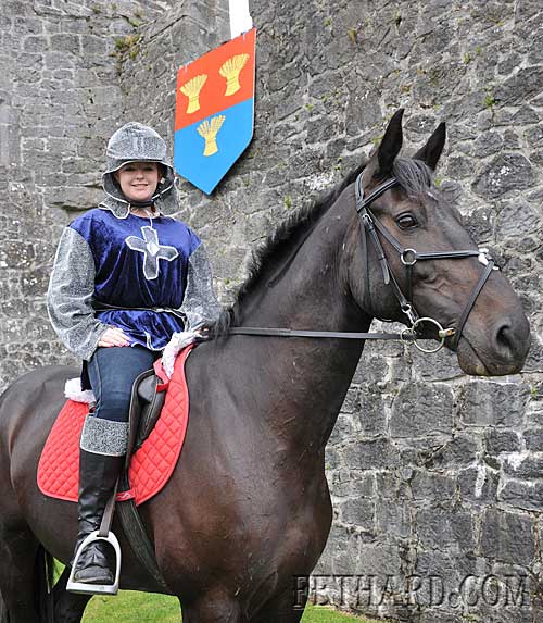 Holly Williamson mounted on her horse 'Sandy' by Fethard Town Wall