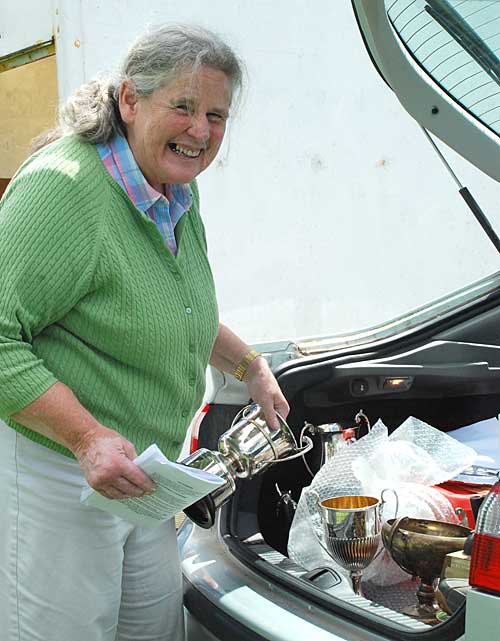 Betsy O'Connor preparing the silverware for prizegiving.