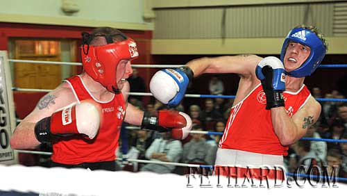 Clonmel Boxing Club's Kevin Fennessy (left) fighting Eric Donovan from Athy in their Senior Lightweight bout in Fethard last Sunday.
