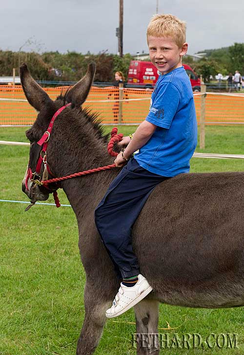Gavin Ryan on a donkey at Fethard Community 'Family Field Day'