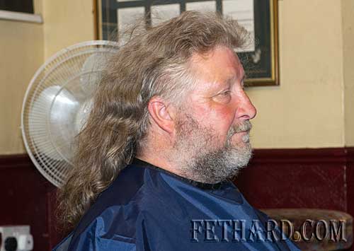 Larry Hopkins before having his head and beard shaved at Lonergan's Bar in aid of the Special Olympics
