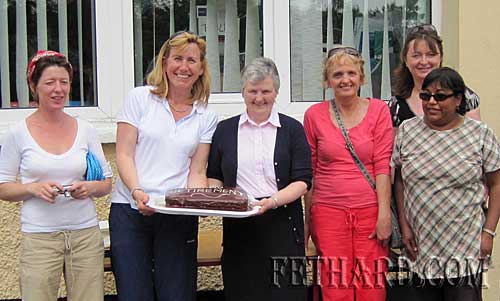Members of the Nano Nagle Parents' Association presenting a cake to Sr. Maureen Power, Principal, who is retiring from teaching at the end of this school year. L to R: Gillian Collier, Siobhán Burke, Sr. Maureen Power, Mary Prout, Carmel Kiely and Koo McDonnell.