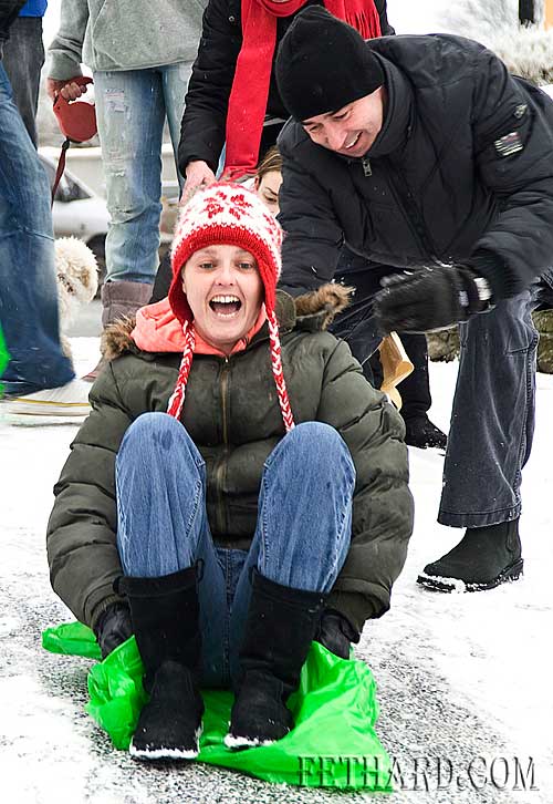Claire Langley preparing to take a slide on the snow at Fethard Ballroom