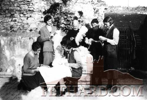   Teasing and combing sheeps wool for quilts at O'Connell's back yard in Fethard are Back L to R: May Kevin, Mrs O'Halloran (houskeeper for the O'Connell sisters), Miss Death. In front are sisters Helen and Phyllis O'Connell. 