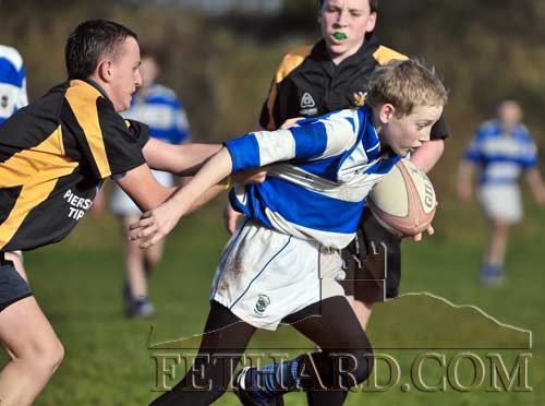 Andrew Phelan breaks through a tackle in the Under 15 rugby match between Clanwilliam and Fethard on Sunday, November 11.