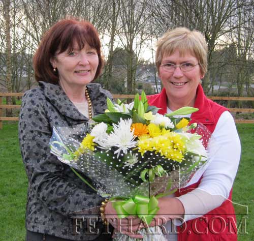 Principal, Patricia Treacy (right) presenting a bouquet of flowers to Mary Hanrahan on the occasion of her retirement from teaching at Holy Trinity National School