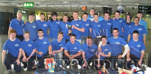 Fethard & District RFCs triumphant return to Dublin Airport with their trophy. Back L to R: Pat O'Donnell (Coach) Kieran Whyte, Tadhg Fogarty, Joey Purtill, Joss Murray, Ger Gorey, Cian O'Connell, Adam O'Connell, James Burn, Liam O'Brien, William Morgan, Thomas MacGabhann, Adam Kealy, Tony Fitzgerald (Coach). Front L to R: Luke Keating, Keith Bergin, Cathal Meagher, Paul Butler, Shane Cleere, William Ryan, David Morgan, Adam Fitzgerald and Cathal O'Donnell.