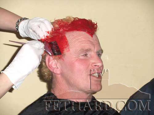 Willie O'Meara, one of the six participants, having his hair dyed in the recent  'Shave or Dye' event held at The Well Bar in aid of the Irish Cancer Association