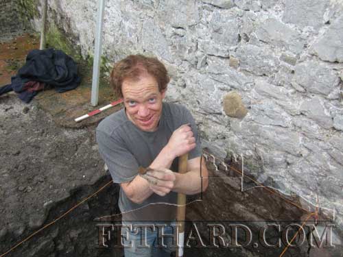 Phil Kenny in a state of some considerable excitement after finding the piece of medieval pottery that helps to push the date of the Town Hall back at least two centuries. (Photo Kilkenny Archaeology)