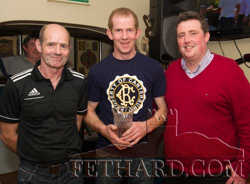 Niall Higgins (centre) receiving the Butler's Bar Fethard Sports Achievement Award for March from this months sponsor, Barry O’Connor (right), Accounting & Bookkeeping Service Clonmel. Also included is this month's special sporting guest, Tom Halpin.