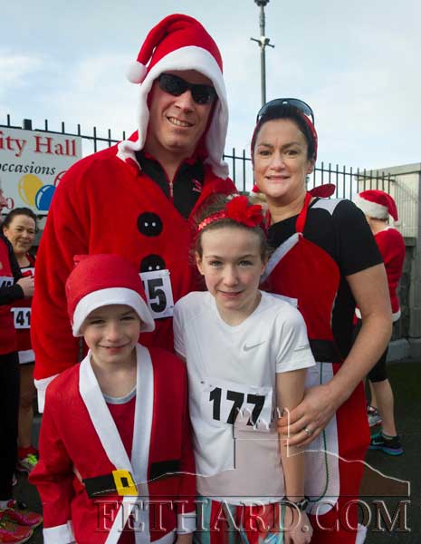 Taking part in the Fethard Santa Run were Podge and Kay Carroll with their children Louis and Ruby in front. Podge and Kay also won the best 'Santa Costume'.