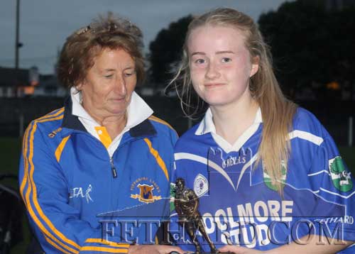 Ladies Football chairperson, Biddy Ryan (left), presenting the the ‘Player of the Match’ trophy to Kate Davey. 