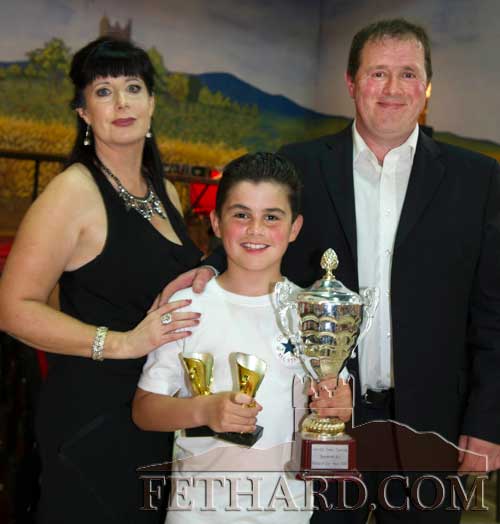 Organisers Marina Mullins and Tom Delaney presenting the 'Dancer of the Night' trophy to Callum Doheny.