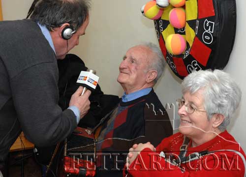 Tipp FM Radio 'Down Your Way' presenter Eamon O'Dwyer interviewing musicians John Pollard and Pauline Morrissey at Fethard & District Day Care Centre.