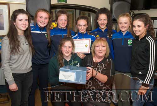 Anne Butler (front right), representing this month's sponsor Butler's Bar, presenting the Fethard Sports Achievement Award for May to team captain Lucy Spillane, who accepted the award on behalf of the Fethard U16 Ladies Football Team who won the County A Championship beating Aherlow in the final. Also included in the photograph are team members Back L to R: Ã�ine Ryan, Maggie Fitzgerald, Nell Spillane, Alison Connolly, Niamh Hayes, Carrie Davey and Leah Coen.