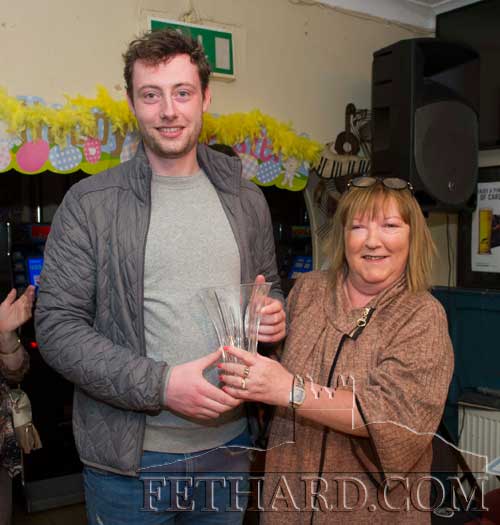 The winner of the Butler's Bar Fethard Sports Achievement Award for March, Charlie Manton, receiving his award from Ann Butler.