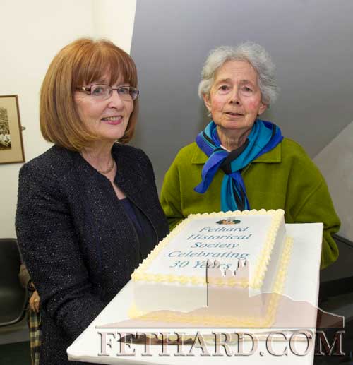 L to R: Mary Hanrahan and Marie O'Donnell, two original and present committee members, ready to cut the cake at the 30th Anniversary Celebrations of Fethard Historical Society
