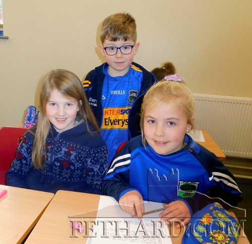 L to R: Roisin Morrissey, Cloneen; Joe Purcell (bronze) and Ines Byrne (silver) from Killusty at the County Final of Community Games Handwriting.