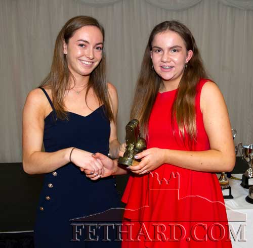 Molly Stapleton who won the most improved on the U14 White team receiving her trophy from Caoimhe Condon.