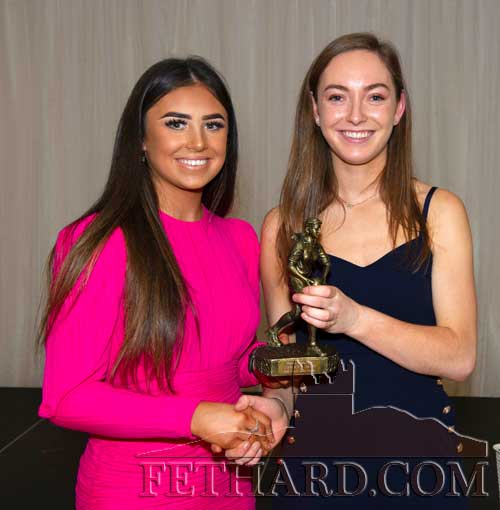 Leah Coen who won the U18 footballer of the year award receiving her trophy from Caoinhe Condon