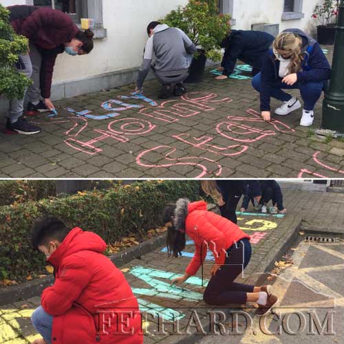 Transition Year students from Patrician Presentation Secondary School are photographe while working on their 'positive' messages on The Square in Fethard on Thursday, October 22