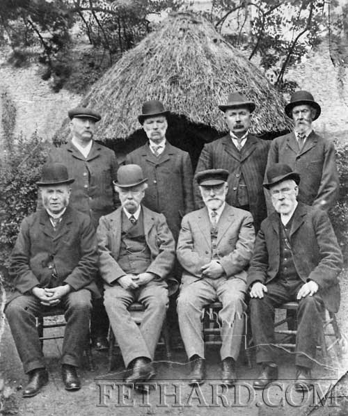 Eight Fethard men including Jack 'Big Buttons' Fitzgerald, Main Street, and his friends photographed in the summer house, at the back of McCarthys Hotel. c.1910