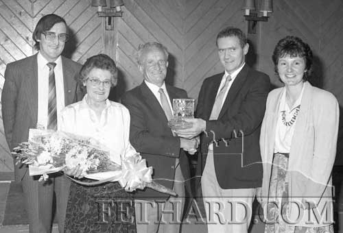 At a special function held in the Fethard Arms on Saturday night, May 20, 1989, a presentation was made to Mr John Pollard, St. Patrick's Place, Fethard, who retired as district overseer after 46 years service with Tipperary (SR) County Council.	The presentation of Tipperary Crystal was made by Mr Michael O'Malley, chief executive county engineer. Ms Breda Power BE of the Carrick-on-Suir district office presented a beautiful bouquet to Mrs Teresa Pollard.	The retirement of John Pollard marked the end of an era. John's father, the late Martin Pollard, served for 40 years as ganger with Tipperary (SR) County Council, while three of his uncles were County Council steamroller drivers. Following the presentation John’s many friends and colleagues joined in a most enjoyable social evening. L to R: Patsy Halloran, Teddie Pollard, John Pollard, Michael O'Malley (Executive County Engineer), Ms Bridget Power (District Engineer).