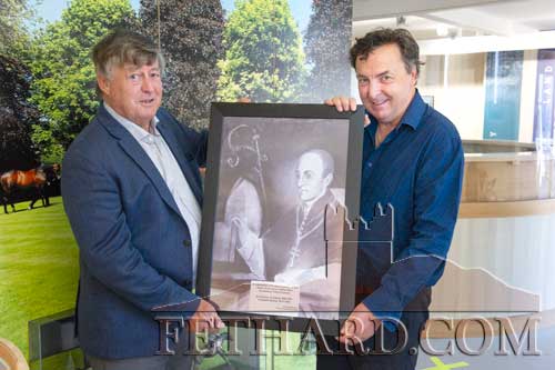 Tom Everard (left) photographed holding the portrait with Donal Sorohan, Contemporary Artist Clonmel.