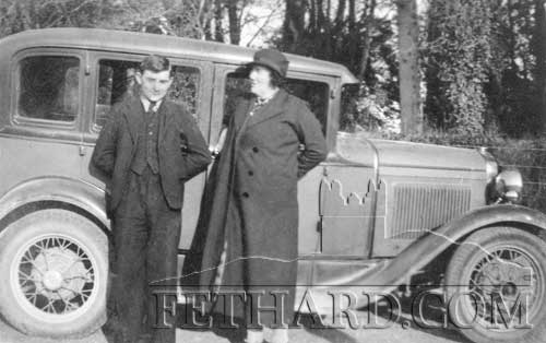 Nurse Stasia Walsh with her son  Paddy in front of car, The Back Green, 1933