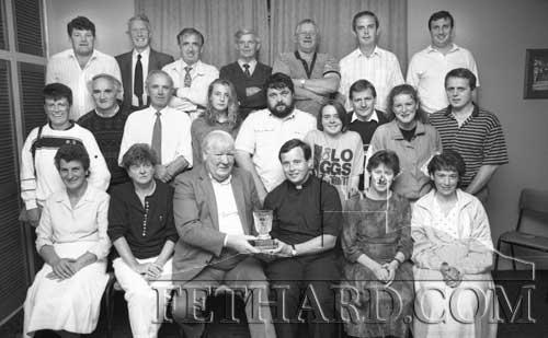 Fethard GAA club members making a presentation to Fr. Michael Ryan on the occasion of his transfer to Dublin. Fr. Ryan was an active member of the local Club during his years spent in the parish of Fethard and Killusty (September 1991).